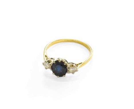 A Sapphire and Diamond Three Stone Ring, stamped ‘18CT’, finger size OGross weight 2.7 grams.