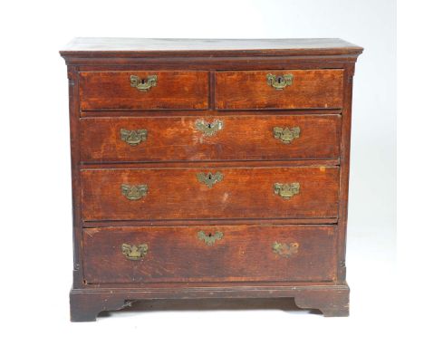 A George III oak and mahogany crossbanded chest of drawersWith a rectangular moulded plank top above two short and three  lon