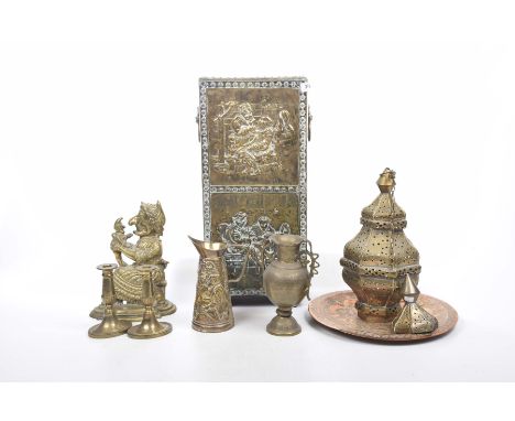 Eight items of brass and copper wareTo include an embossed brass stick stand with lion mask ring handles, pierced Eastern bra