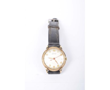 A 9k gold Accurist manual wind wrist watchWith Arabic numerals to a leather strap