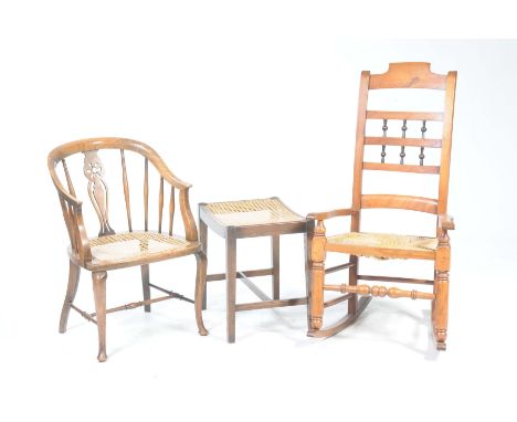 A 19th Century beechwood ladder back rocking chairThe rail back with two rows of three turned spindles above an envelope rush