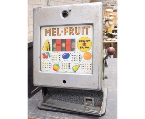 A vintage Melroy automatics "Mel-Fuit" penny slot machineWith a chromed metal hinged front, enclosing a glass window with thr