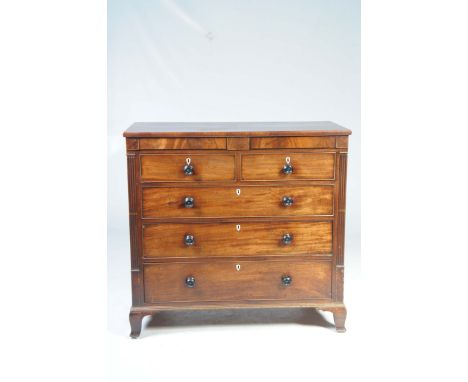A George IV mahogany chest of drawersThe  rectangular top above two secret frieze drawers over two short and three long cockb