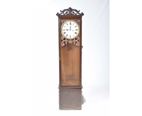 A 19th Century oak cased longcase clockHaving a scrolling foliate and shell crest above a 12" white enamelled dial with a sub