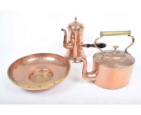 Three copper itemsTo include a chocolate pot with a brass acorn finial and turned ebonised side handle, a Victorian copper ke
