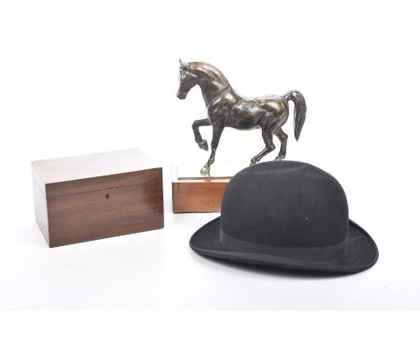 A cast metal figure of a horse, 19th Century tea caddy and bowler hatThe horse mounted upon a rectangular brass plinth and ha