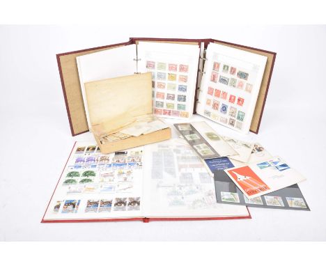 A collection of stampsTo include first day covers, loose stamps and three stamp albums, including American and South American