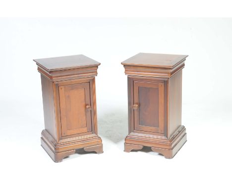 A pair of reproduction mahogany Georgian style pot cupboards by Willis & GambierEach with a moulded frieze drawer above a sin