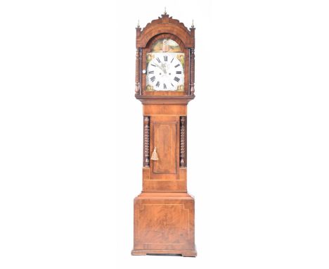 A 19th Century mahogany eight day longcase clockWith a painted break arch dial, the spandrels painted with cottages enclosing