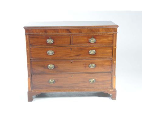 A George IV mahogany chest of drawersWith a rectangular moulded crossbanded top above two short and three long cockbeaded dra
