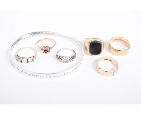 A 9k gold signet ringTogether with, two 9k gold gem-set rings, two 9k gold bands, with a silver bangle, and a silver dress ri