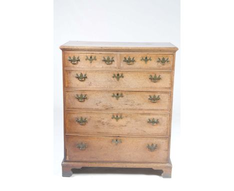 An early 19th Century oak and mahogany crossbanded chest of drawersThe rectangular moulded top above two short and four long 