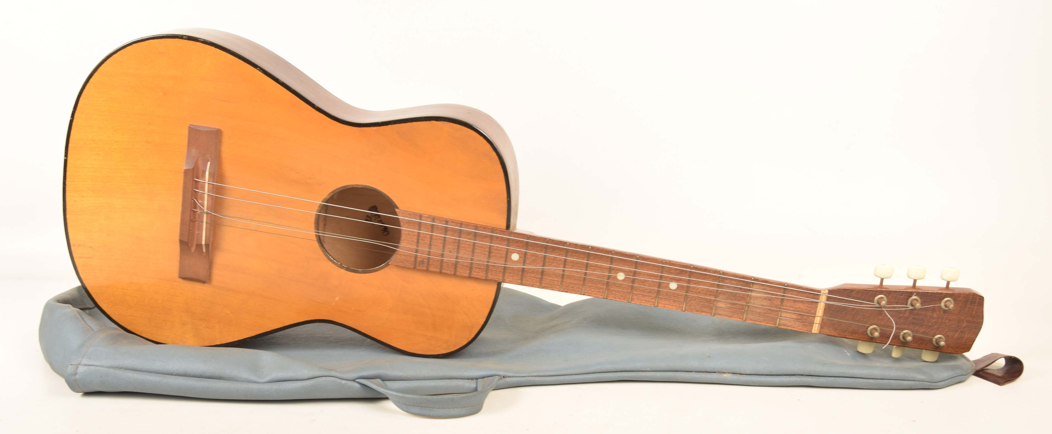 A cased acoustic guitar with a stained beech wood back, 20th century.