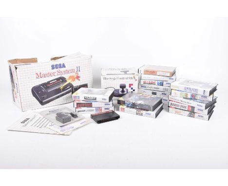 A boxed Sega Master system IIBox containing machine, gun, control pad etc, Sega control stick, various games to include Juras