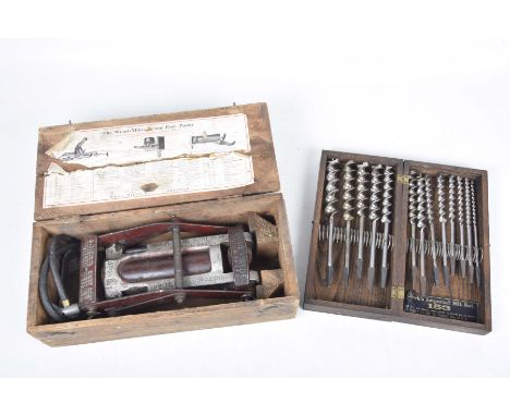 A vintage boxed Wood-Milne patent foot pump and a Clark's Imperial bit set.The Clark's Imperial 153 thirteen piece bit set wi