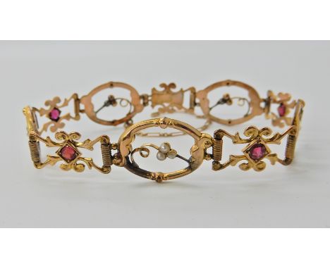 A yellow metal red gem and pearl bracelet made by Edward Durban &amp; Co, weight 6.7gms  Condition Report: 