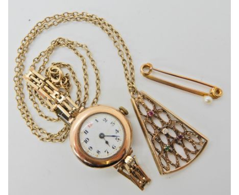 A yellow metal retro pendant set with diamond emerald and ruby, a yellow metal pearl set brooch and a 9ct cased vintage watch