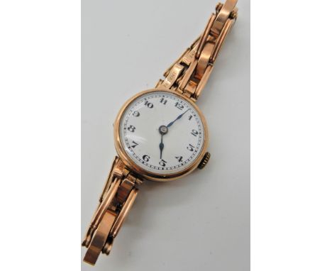 A 9ct gold ladies vintage watch and strap, weight including mechanism 22.2gms approx  Condition Report: 