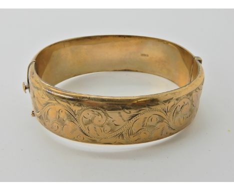 A 9ct gold wide bangle, weight approx 23.2gms  Condition Report: 