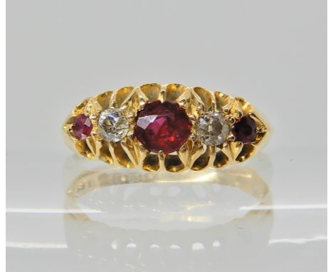 An 18ct gold ruby and diamond ring hallmarked Chester 1914, finger size N  Condition Report: 