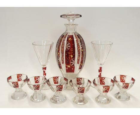 A Bohemian ruby flashed and cut glass liquor set comprising decanter, 24cm high and six glasses and a pair of stemmed liquor 