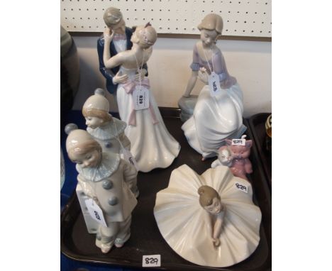 Two Lladro figures of children in Pierrot outfits, Amore by Juliana figure group of a couple and three Nao figures of a seate