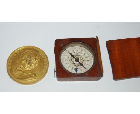 A yellow-metal medallion, pocket compass (2)  Condition Report: 