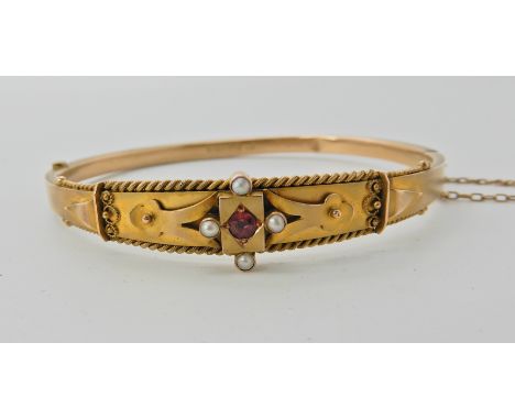 A 9ct gold pearl and red gem set bangle weight approx 7.6gms  Condition Report: 