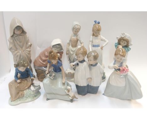 Nine Nao figures including two choirs boys, girls with puppies, girl with doves etc (9)  Condition Report: 