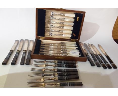 A lot comprising a cased EP and mother of pearl fruit cutlery set and a quantity of agate handled fruit cutlery (15 pieces)  