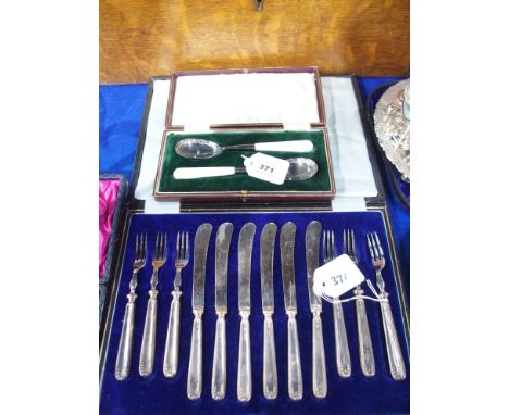 A lot comprising a cased pair of EP and mother of pearl jam spoons and a cased twelve piece silver handled fruit cutlery set,