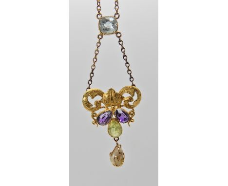 A yellow metal Art Nouveau style pendant set with aquamarine, peridot, amethyst and a freshwater pearl. From the aquamarine, 