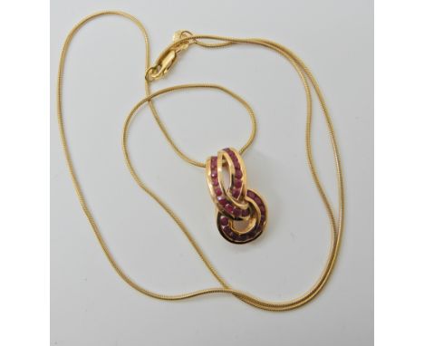 A 9ct gold ruby set pendant and chain, weight approx 5gms  Condition Report: 