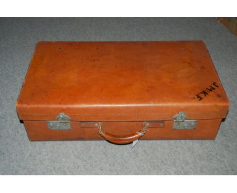 A vintage brown leather suitcase, 66cm wide  Condition Report: 