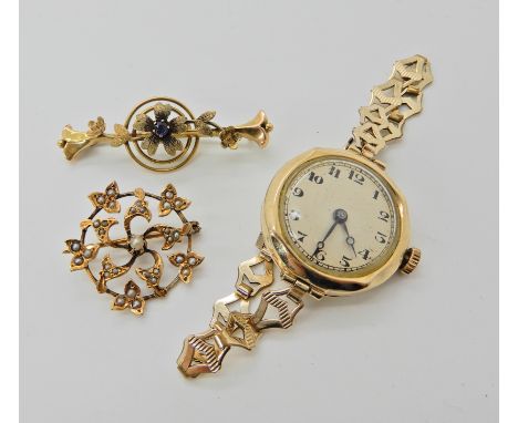 A 9ct gold cased ladies vintage watch, an 18ct gold pearl brooch and a sapphire example in yellow metal  Condition Report: 
