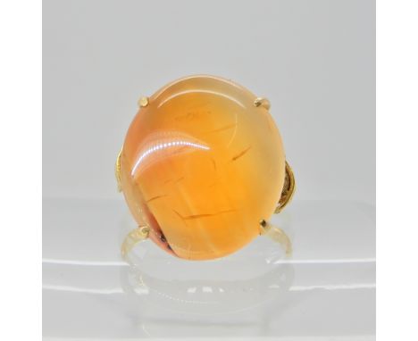 An 18ct gold carnelian set ring, finger size R, weight 6.1gms  Condition Report: 