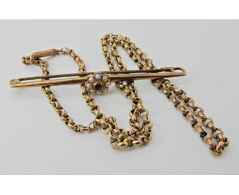 A 15ct gold garnet and pearl brooch and a vintage yellow metal chain  Condition Report: 