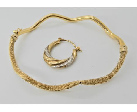 An 18ct gold bangle (af) weight approx 4.3gms and a single 9ct earring weight approx 0.8gms  Condition Report: 