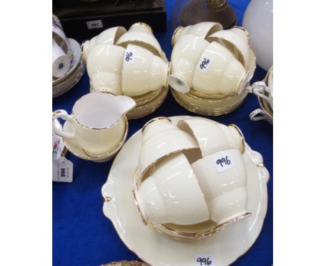 A Hammersley Bone China twelve setting teaset, decorated with pink flowers to the interior and a yellow exterior  Condition R