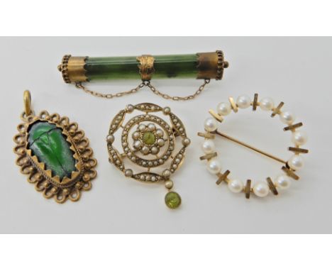 A jewel beetle pendant in yellow metal, a 9ct gold pearl circle brooch, a New Zealand jade brooch, and a further pendant broo