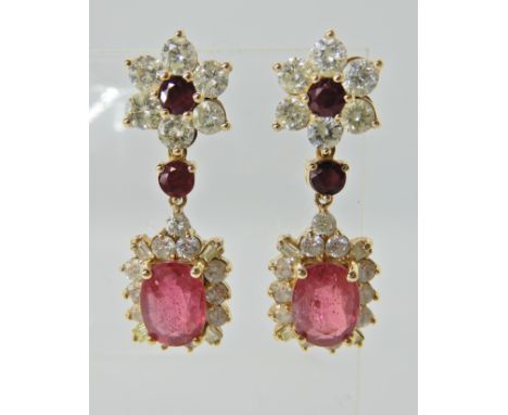 A pair of substantial ruby and diamond earrings, made in bright yellow metal and set with estimated approx 2.8cts of diamonds