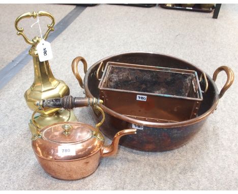 A Copper pan, teapot and planter and a brass door stop  Condition Report: 