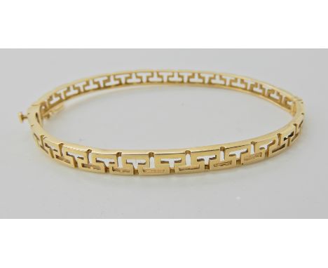 A 14ct gold Greek key pattern bangle  Condition Report: 