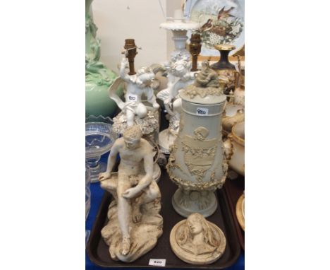 A German salt glazed gnome decorated vessel, pair of white glazed cherub figural table lamps and another, plaster figure of a