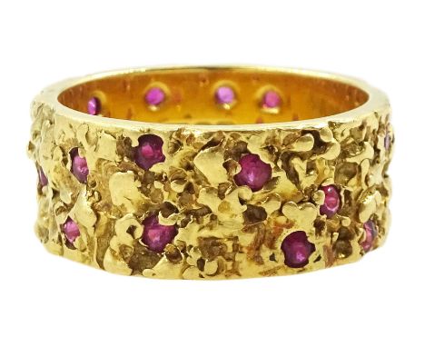 18ct gold textured, round cut ruby scatter ring, London 1966Condition Report:Approx 7gm, size K, depth = 7.7mm, good conditio