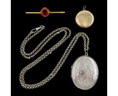 Early 20th century gold citrine brooch, rose gold locket, both 9ct and a silver locket, with engraved decoration, on silver b