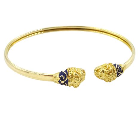 14ct gold torque bangle, with blue enamel lion head finials, stamped 585Condition Report:Approx 9.1gm, very small amount of e