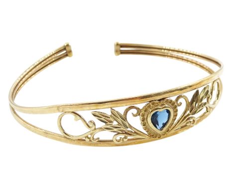 9ct gold heart cut blue topaz, pierced foliate design torque bangleCondition Report:Approx 6.3gm, tested 9ct, inner circumfer