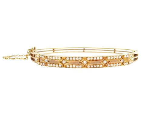Early 20th century 15ct gold old cut diamond and split pearl hinged bangle, stamped 15Condition Report: Approx 11.8gm, good c