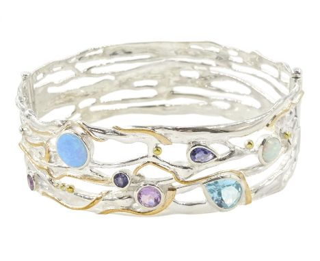 Silver and 14ct gold wire opal, topaz, amethyst and iolite hinged bangle, stamped 925Condition Report:Inner circumference = 1